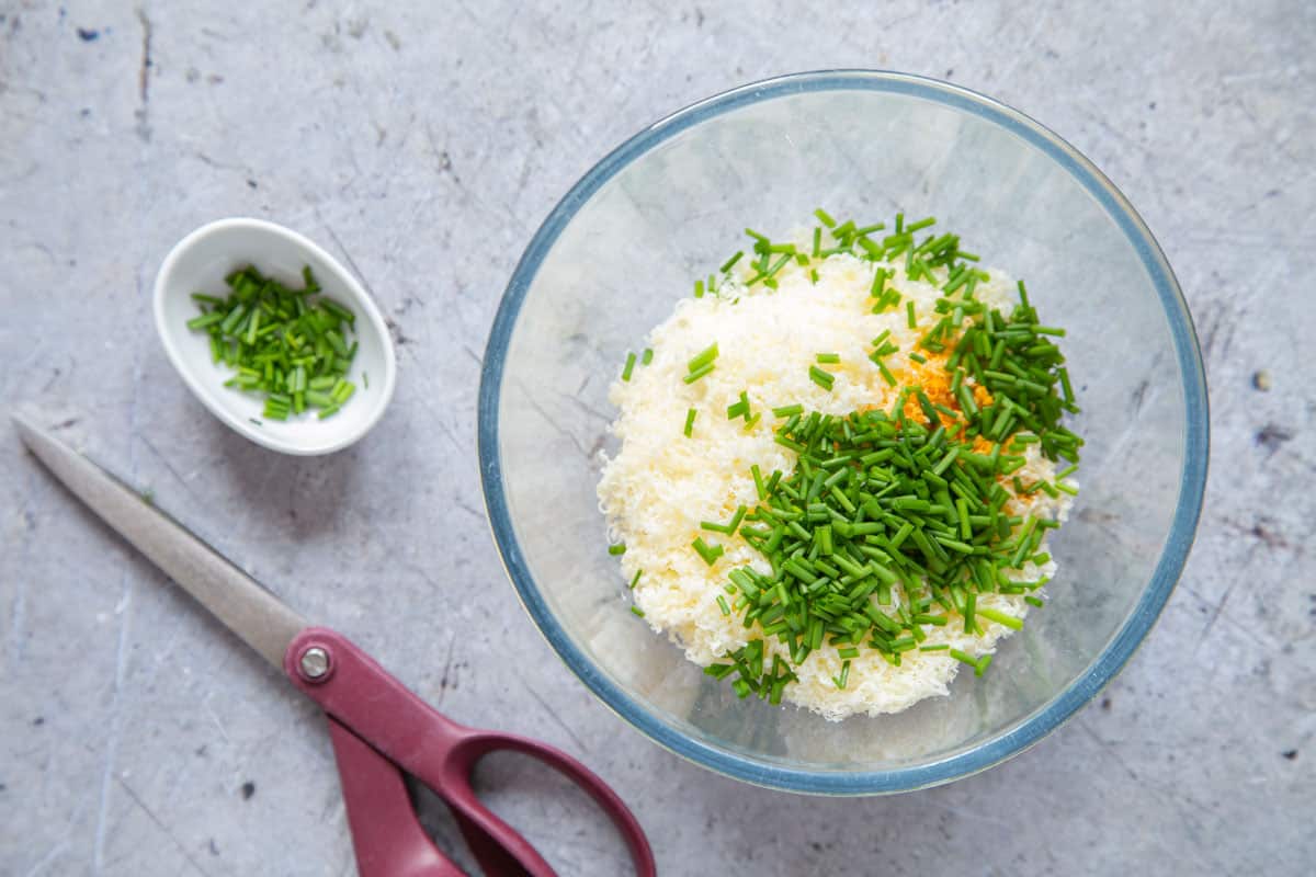 All the ingredients in a bowl, the chives snipped with a pair of scissors.