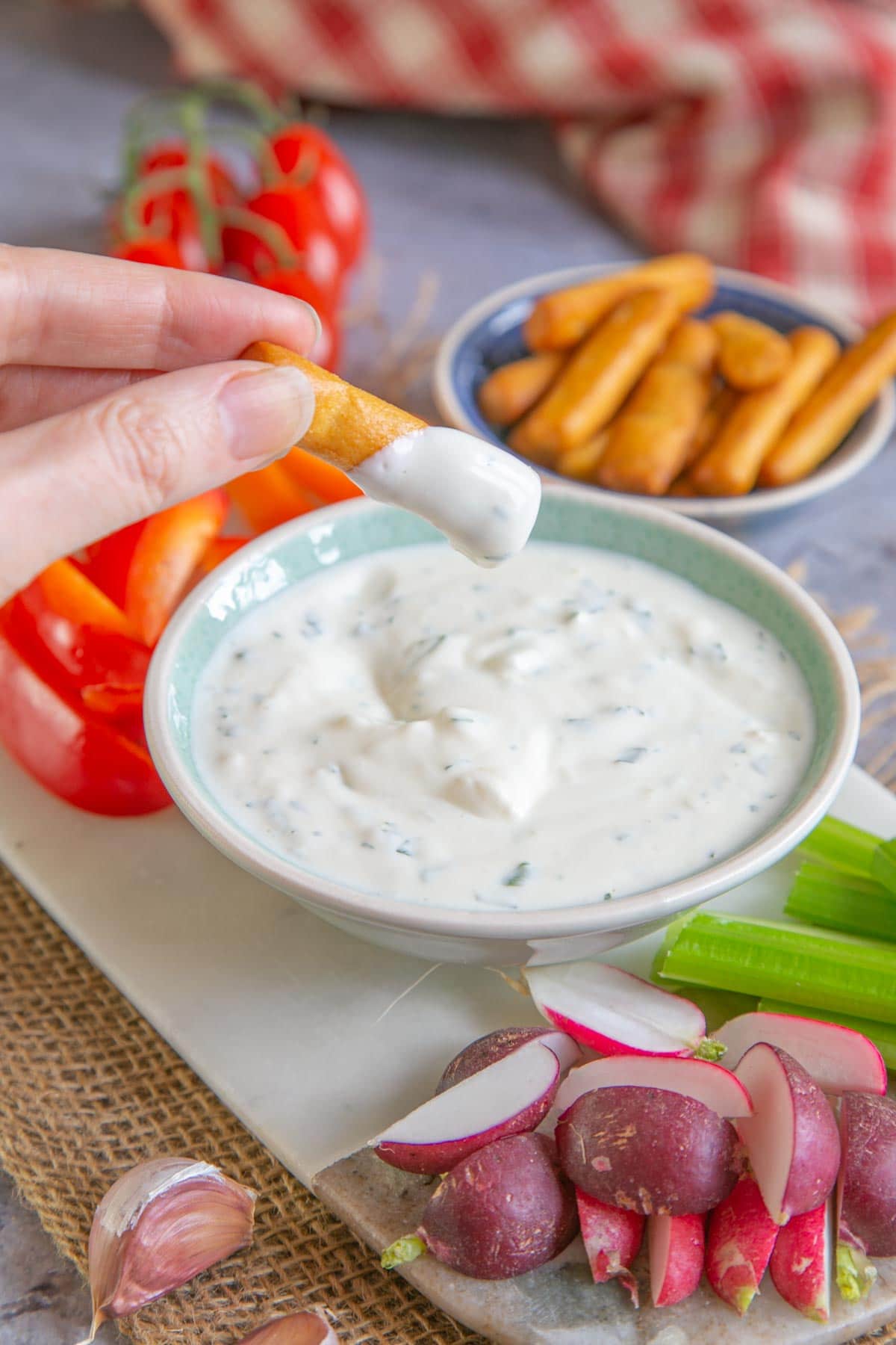Garlic and onion dip with savoury snacks and crudités - perfect for parties and lazy nights in.