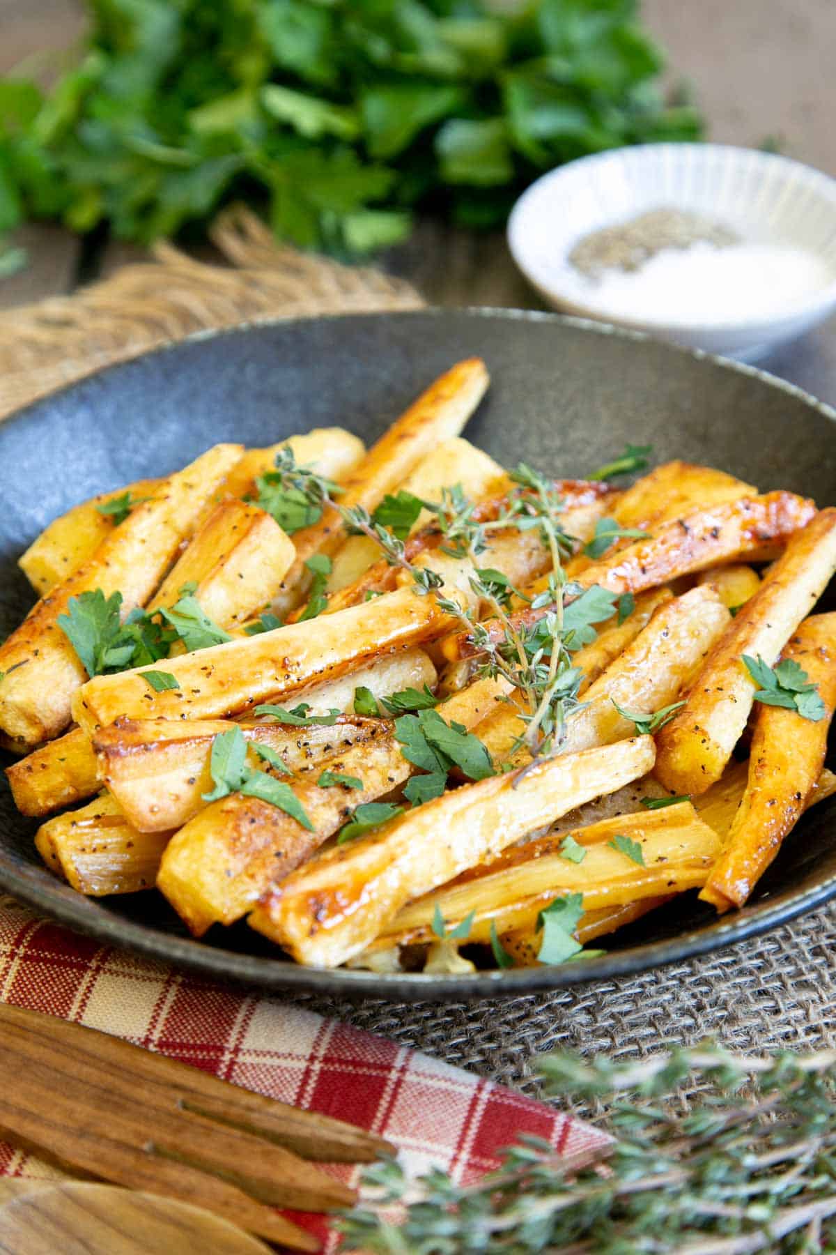 Honey roast parsnips on the table, ready to serve as part of a traditional roast or any of your favourite dishes.