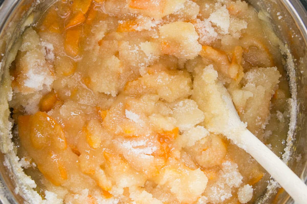 Sugar added to marmalade, before dissolving..