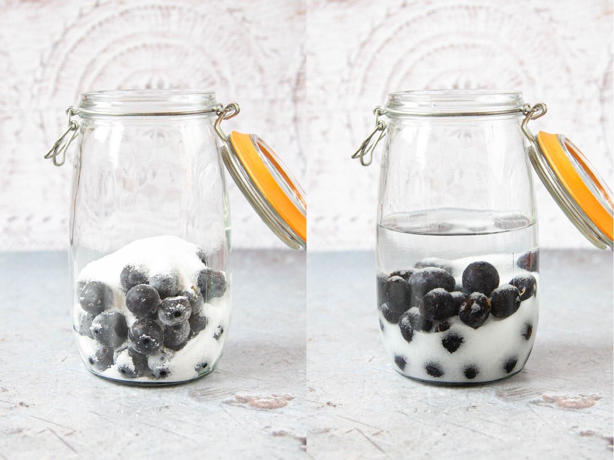 Damsons, sugar and vodka added to a wide mouthed clip top jar. The jar is half full of liquid