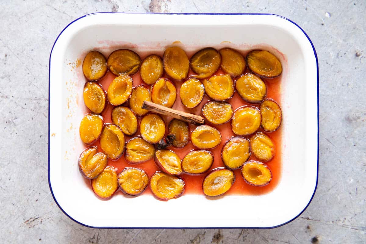 After cooking, the plums are soft and tender, sitting in a rich sweet syrup