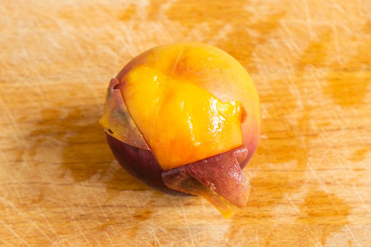 a peach which has been half peeled