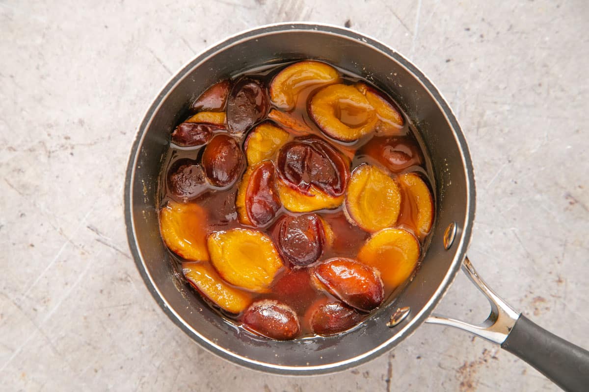Stewed plums are ready when cooked until soft. They have released a lot of juice.