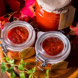 Chunky tomato sauce preserved in attractive Mason jars and clip-top jars with rubber seals.