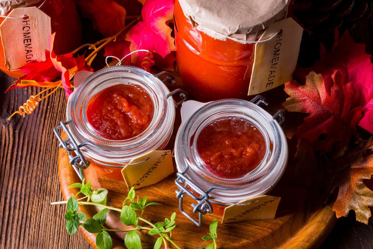 Chunky tomato sauce preserved in attractive Mason jars and clip-top jars with rubber seals.