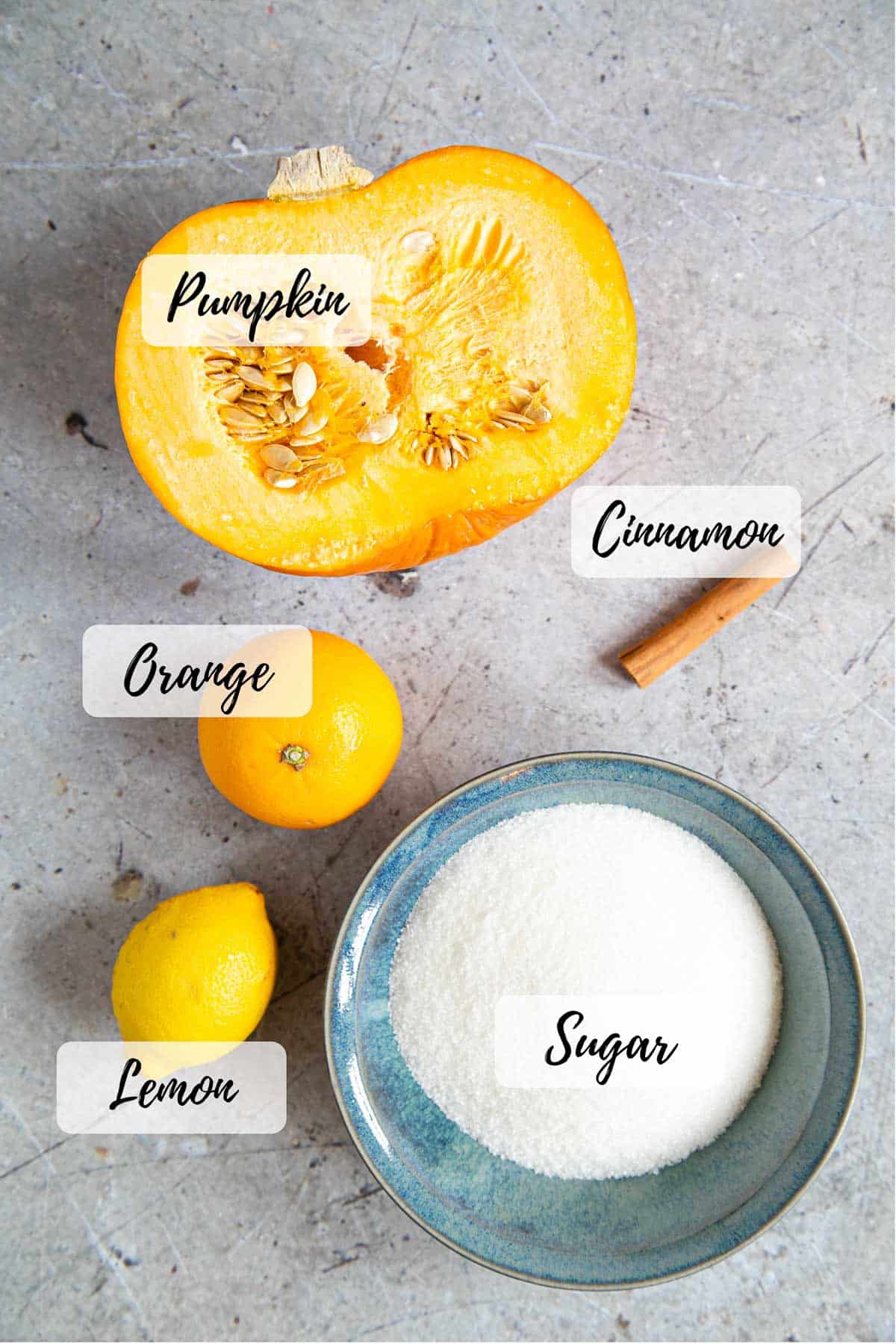Pumpkin jam ingredients: cinnamon, sugar, lemon, orange and pumpkin