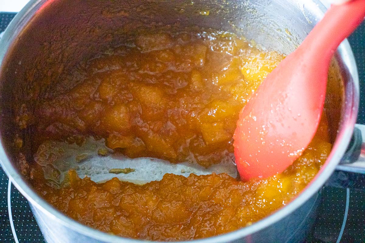 The pumpkin jam has thickened and does not fall back into the space when you draw a spoon through it.