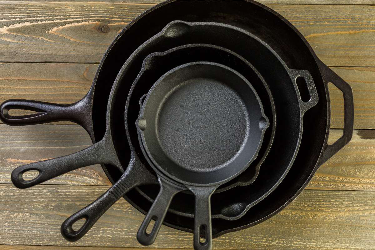 Cast iron pans of different sizes, stacked