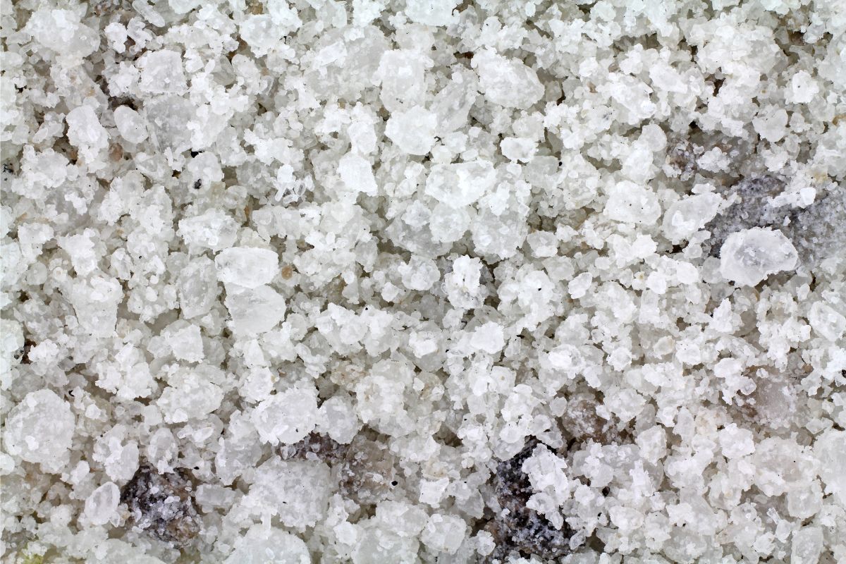 A close up of crystals of salt of differing sizes.