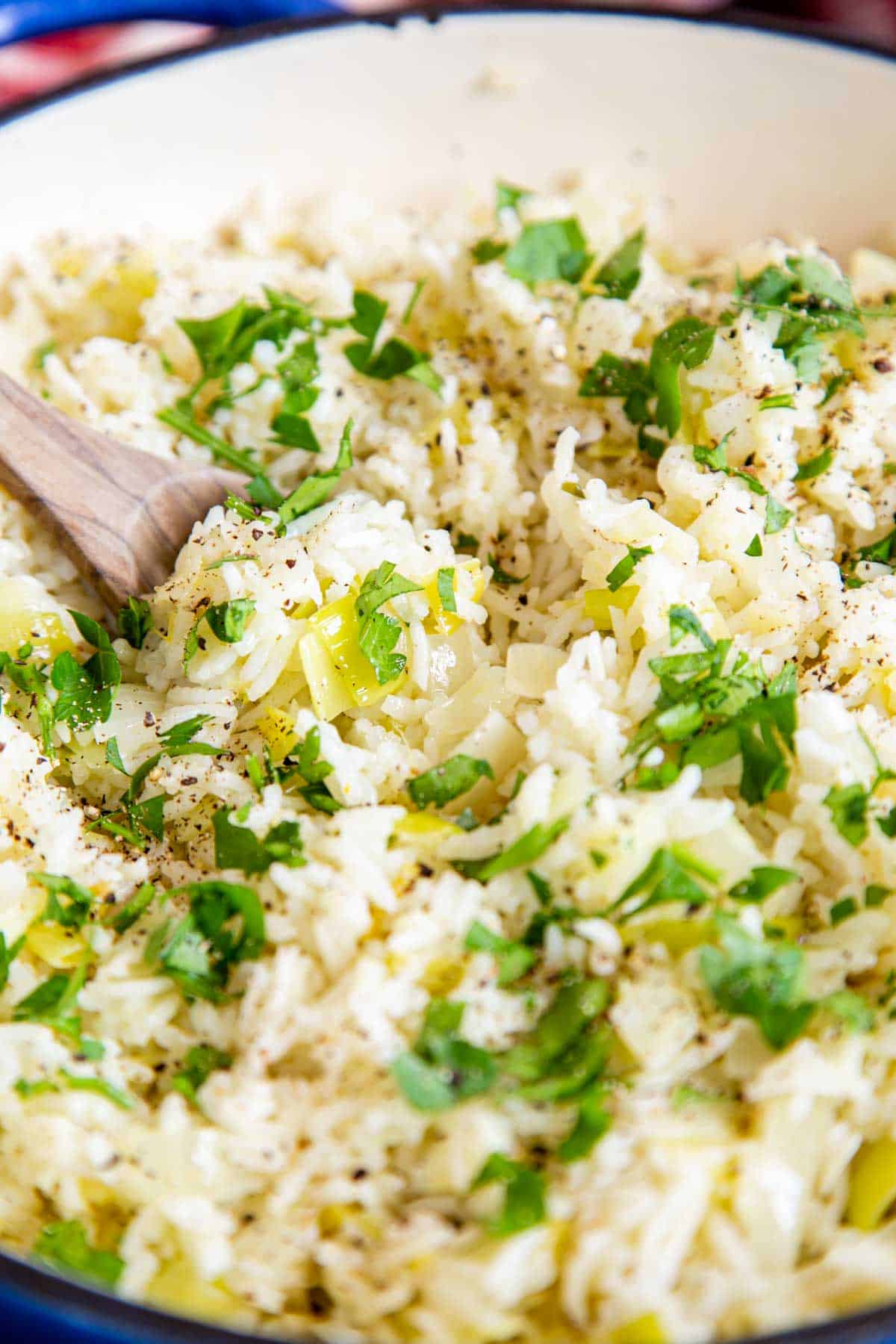 Serving up light, fluffy, leek rice pilaf, garnished with chopped parsley