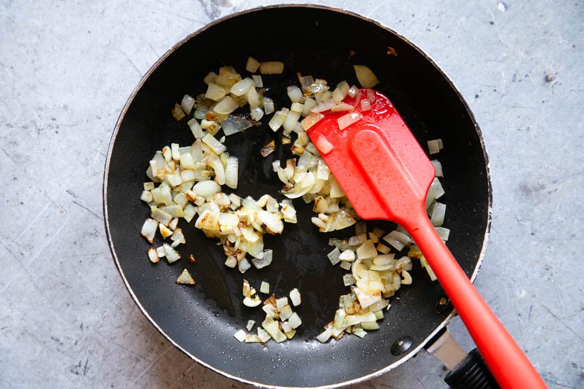Frying the chopped onion - it should be soft and golden.