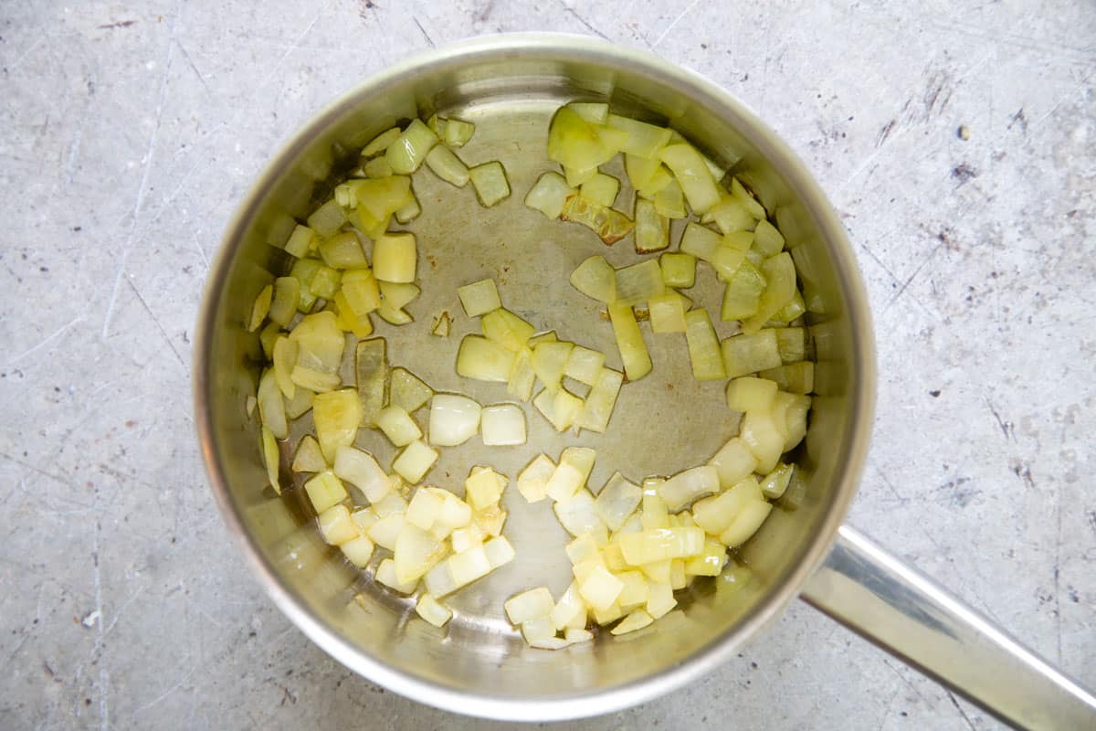 Frying the onion in a little oil.