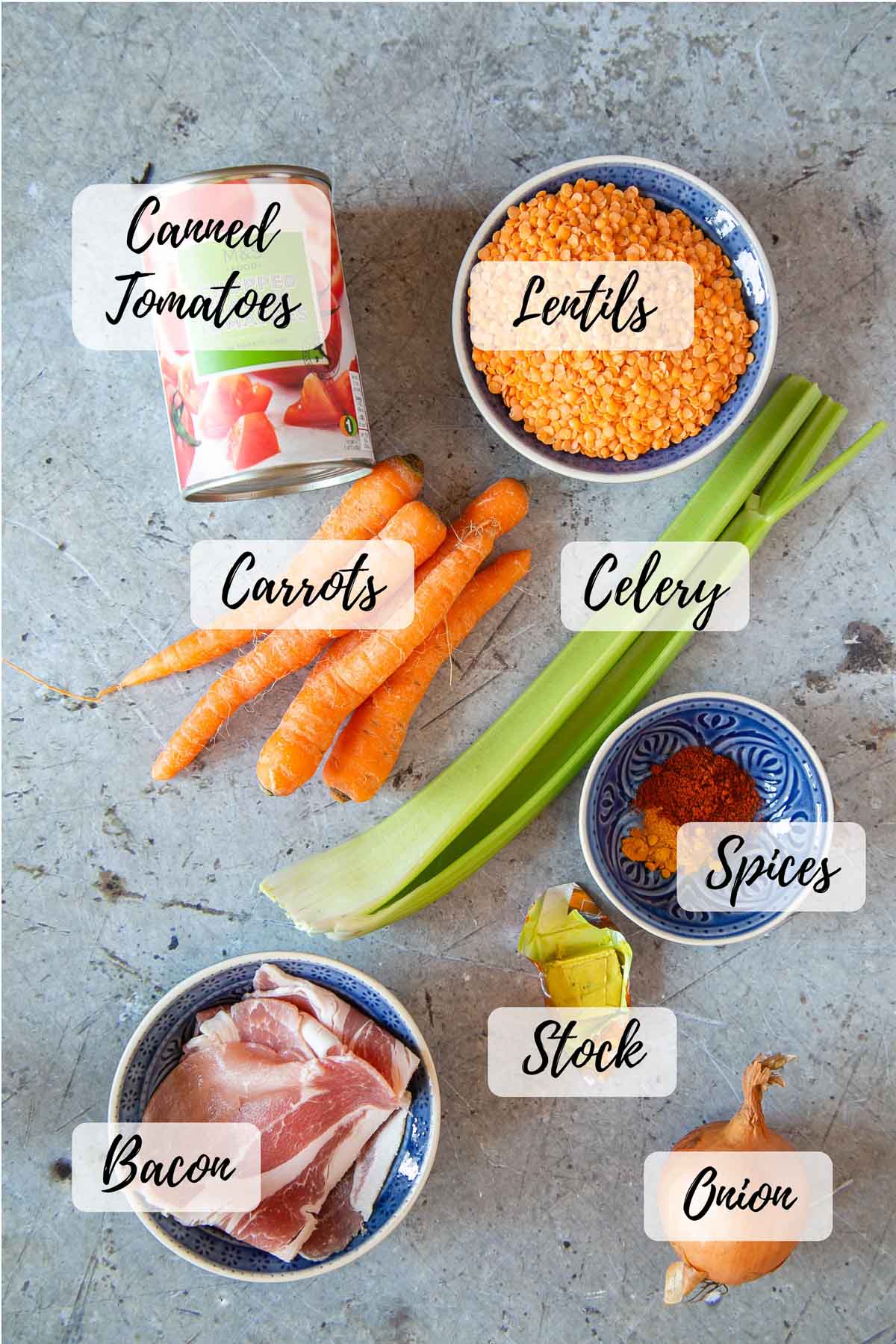 The ingredients - a tin of tomatoes, red lentils, celery, spices, stock, onion, bacon, carrots.