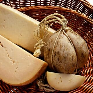 Whole and cut provolone cheese