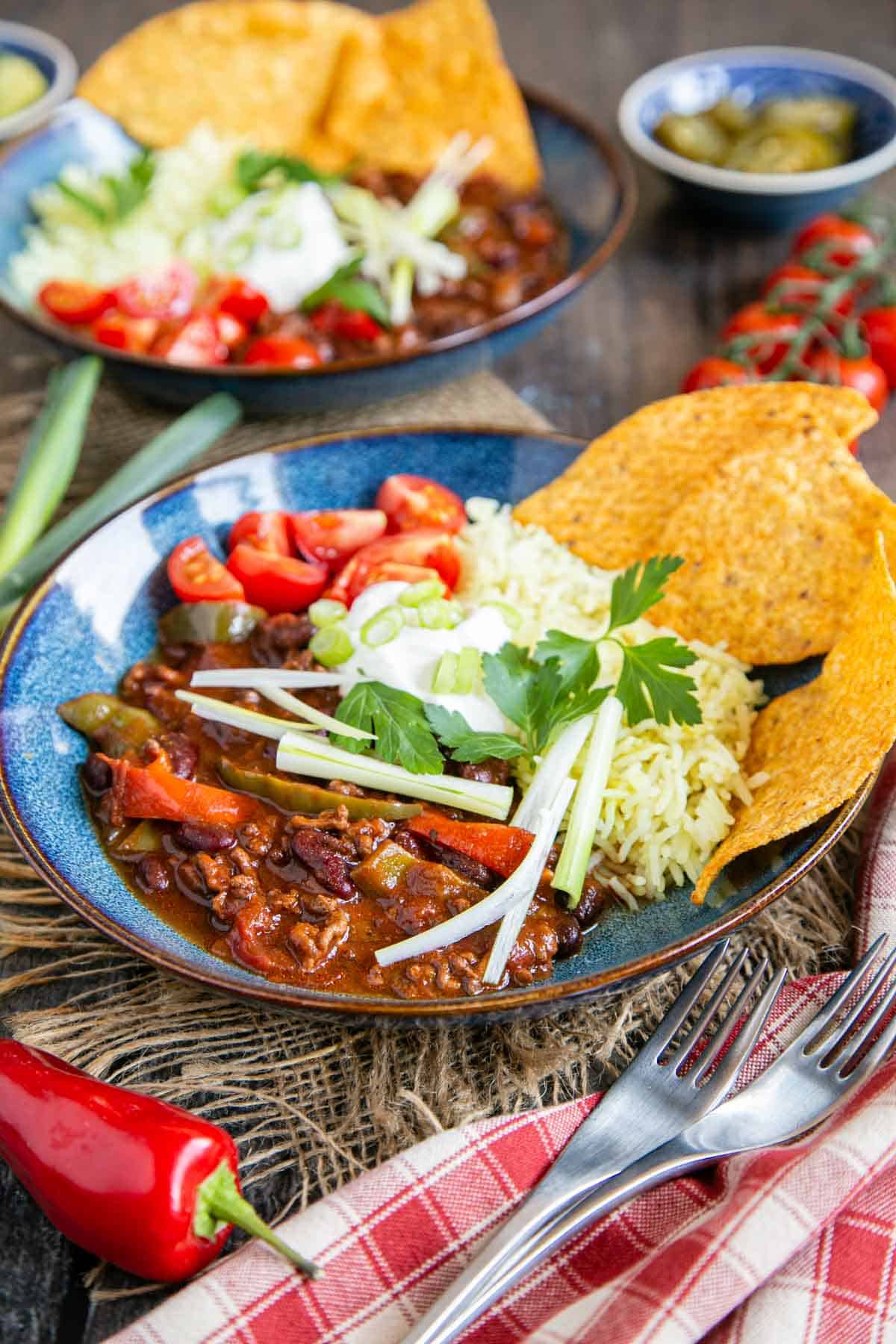 Deliciously dark and warming beef chili served with rice, tacos and salad toppings.