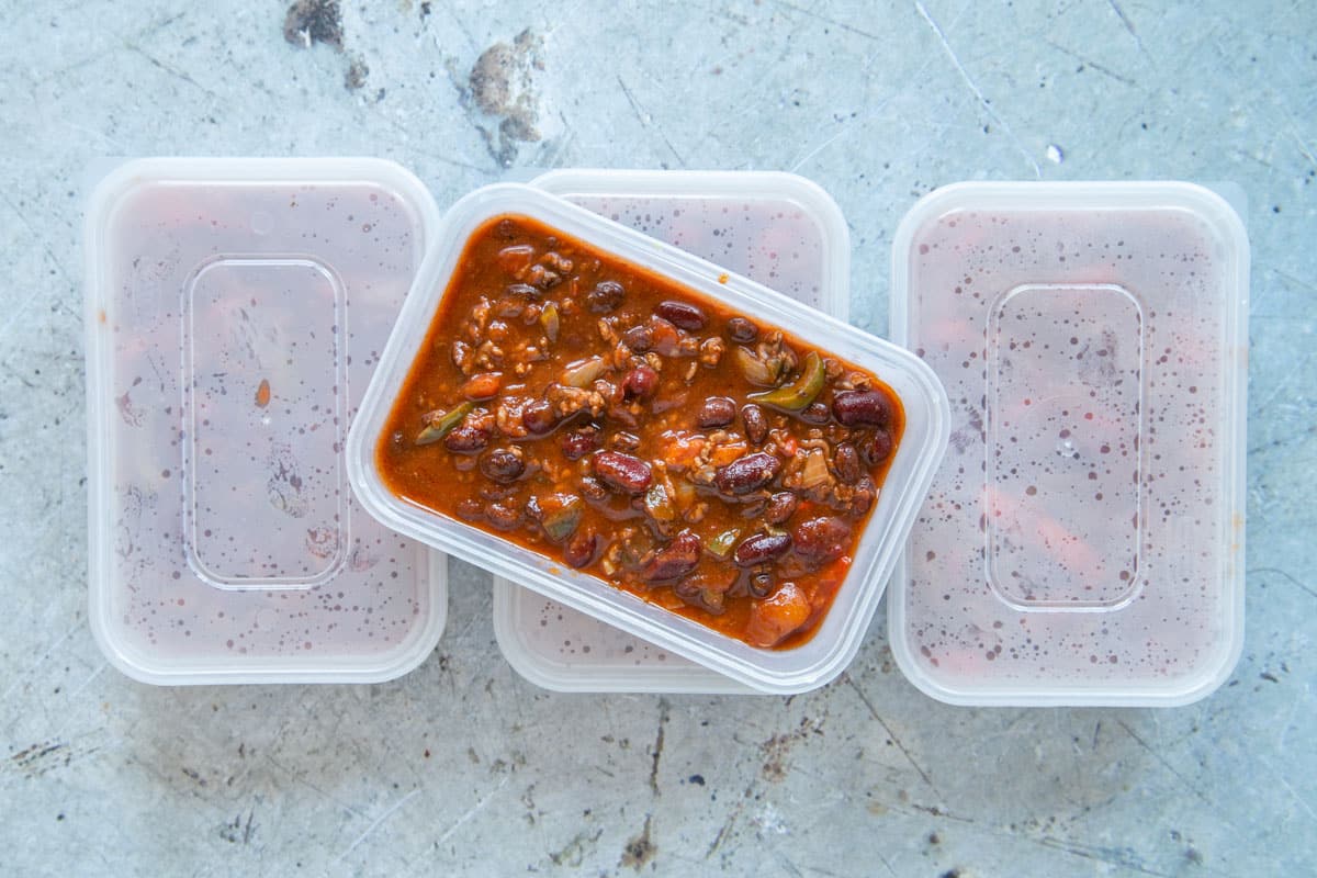 Packing the chili into freezer trays for a rich, warming meal any time you need it.