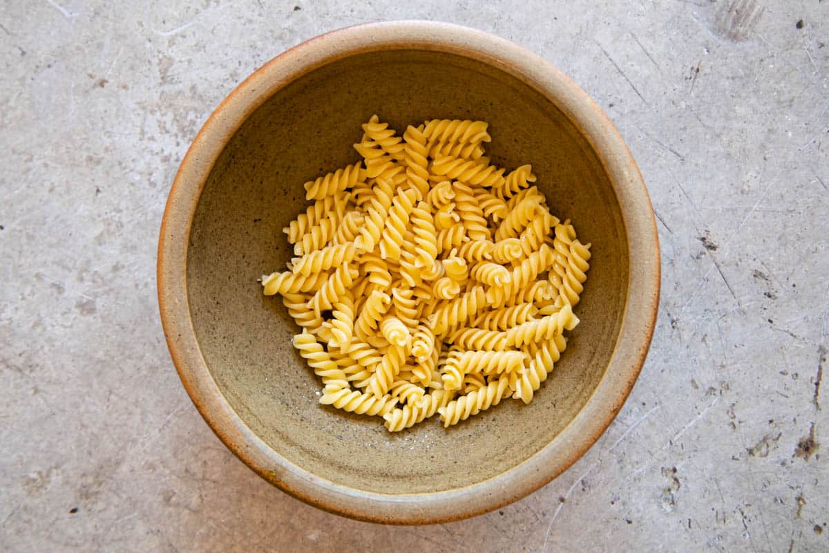 The freshly cooked and drained pasta in a bowl.