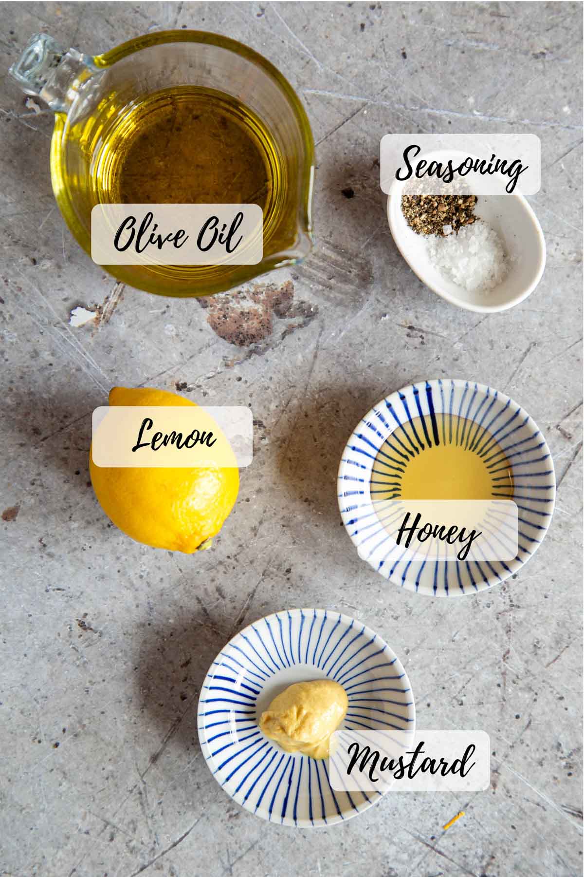 The ingredients: olive oil, seasoning, honey, mustard and lemon