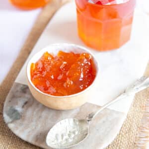 Close up on a small bowl of grapefruit marmalade.
