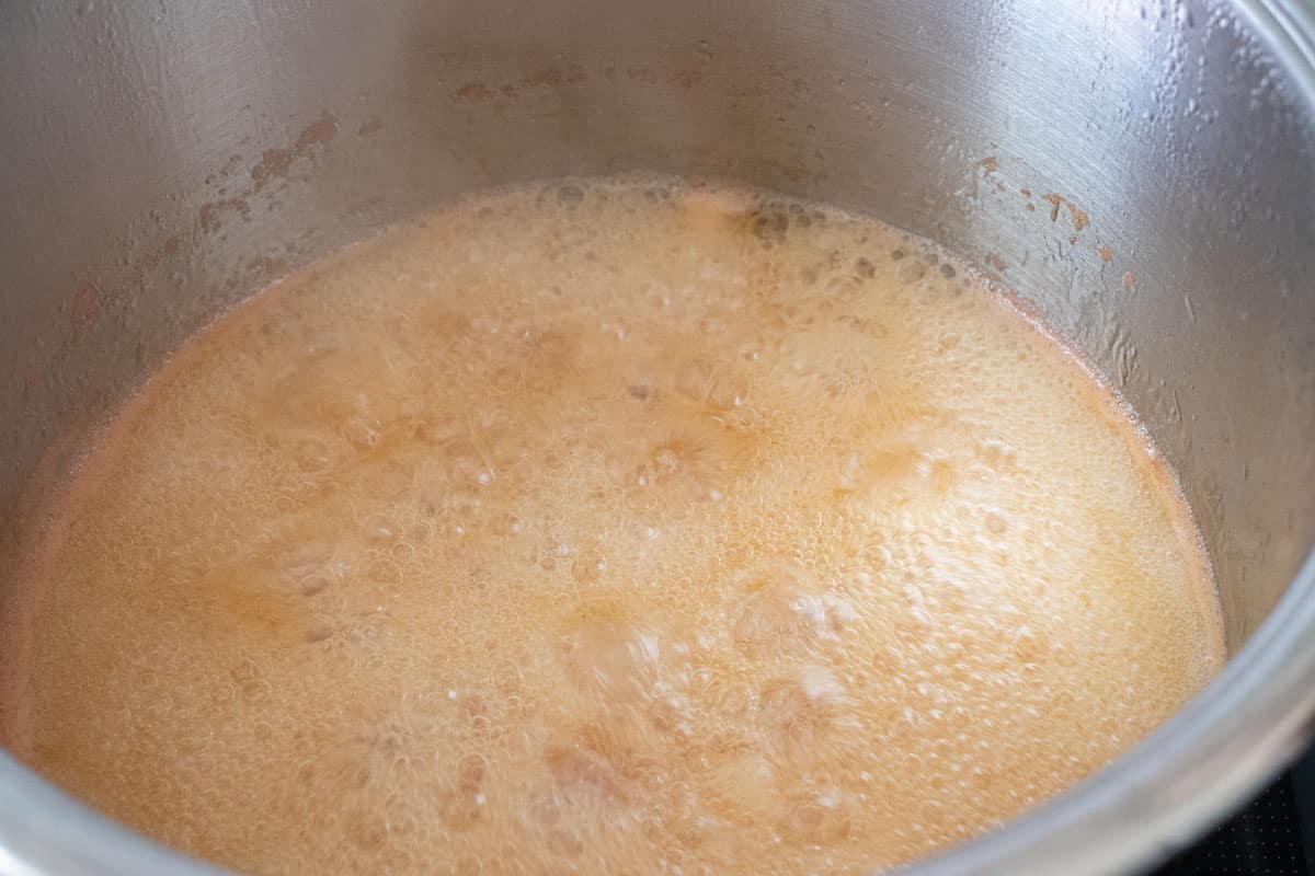 A large saucepan of marmalade at the boil.