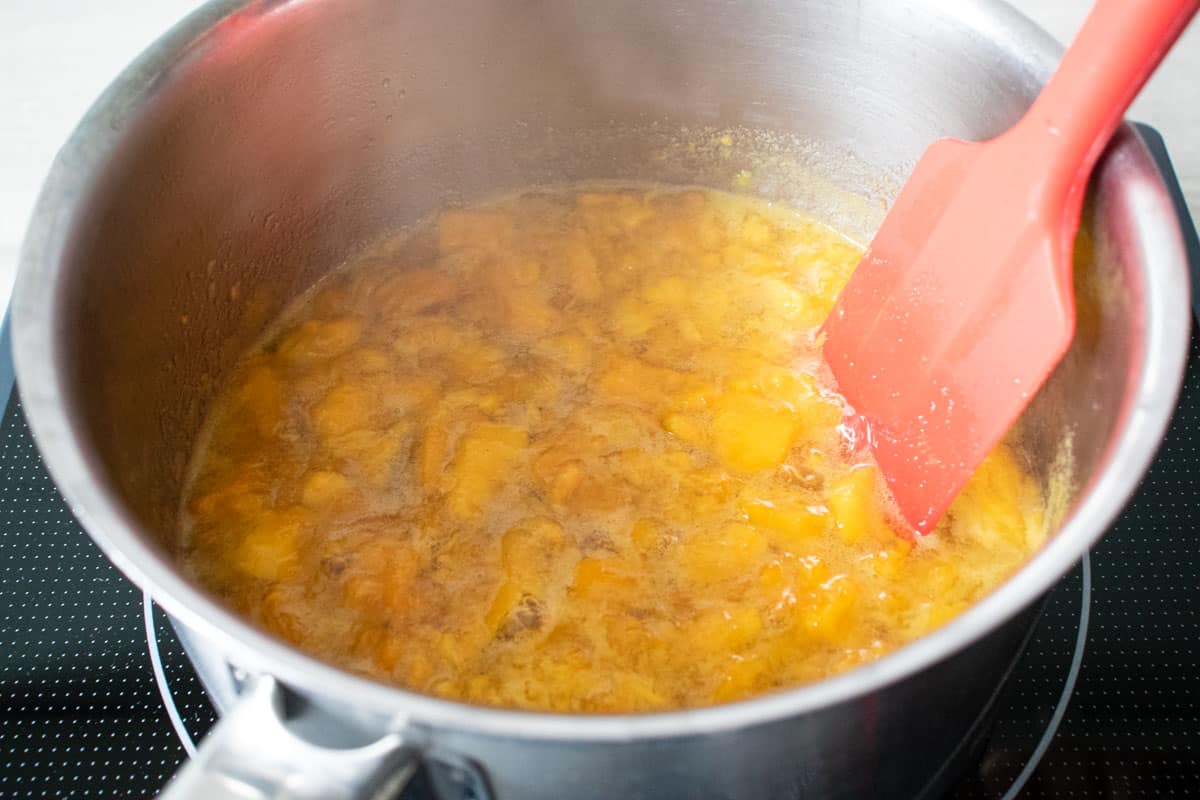 Cooking the jam. It is is important to have plenty of space in the pan, as when it starts to boil, the jam will expand and rise up.