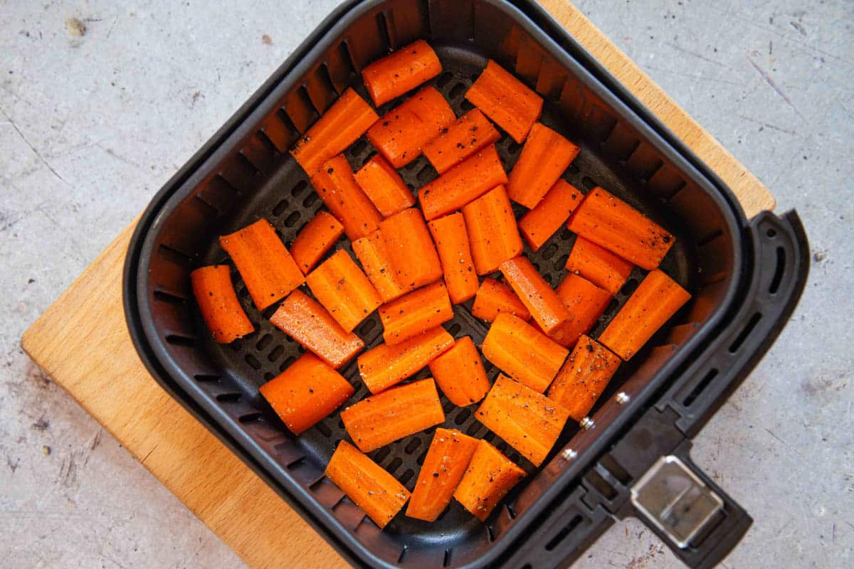The carrots in the air fryer basket.