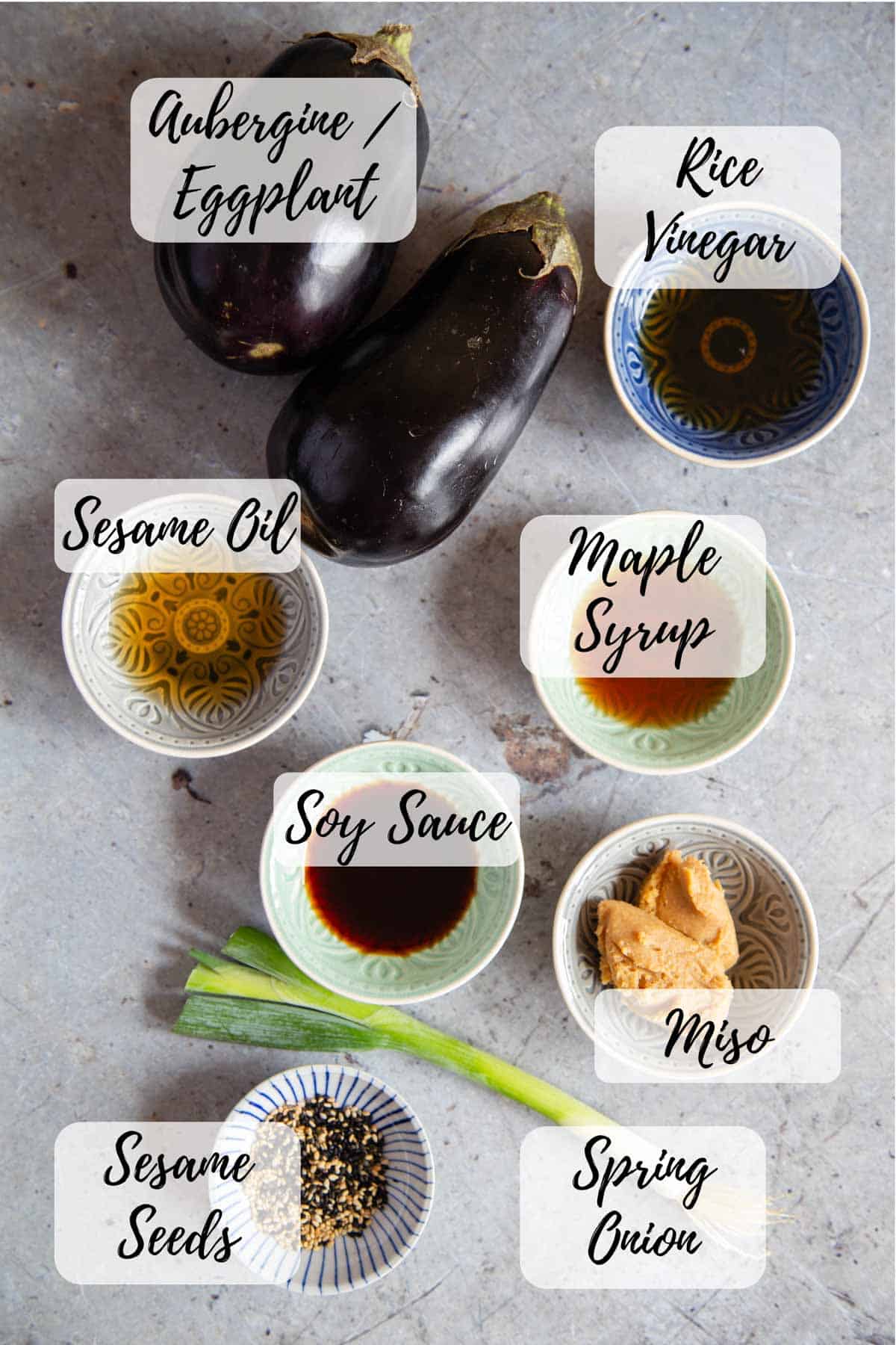 Ingredients for miso aubergine: aubergine/eggplant, rice vinegar, maple syrup, miso, spring onion, sesame seeds, soy sauce, sesame oil.