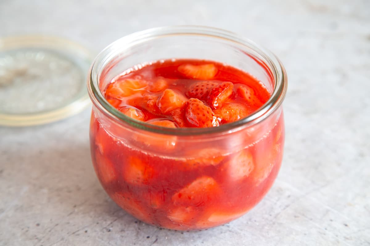 The finished compote transferred to a glass jar.