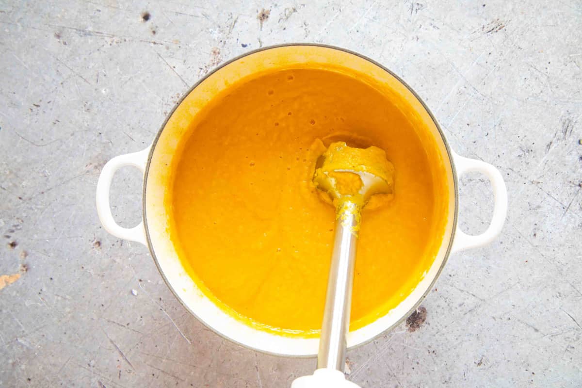 A stick blender is by far the best way to get a smooth soup.