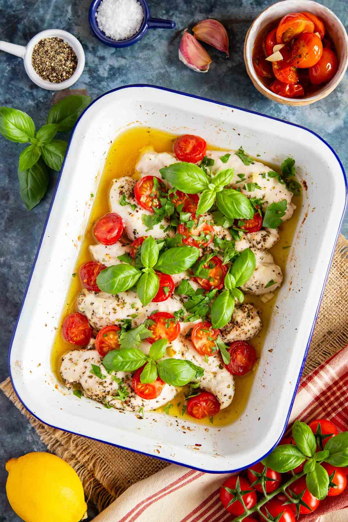 The roasting dish on the table ready to serve, the juices golden and full of flavour.