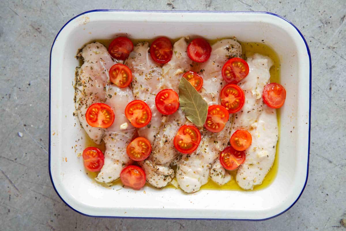 The dish after ten minutes in the oven covered in foil - the chicken is lightly poached.