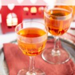 Marmalade vodka in liqueur glasses, crystal clear and inviting.