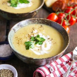 bowls of rich, smooth leek and potato soup on the table, ready to enjoy.