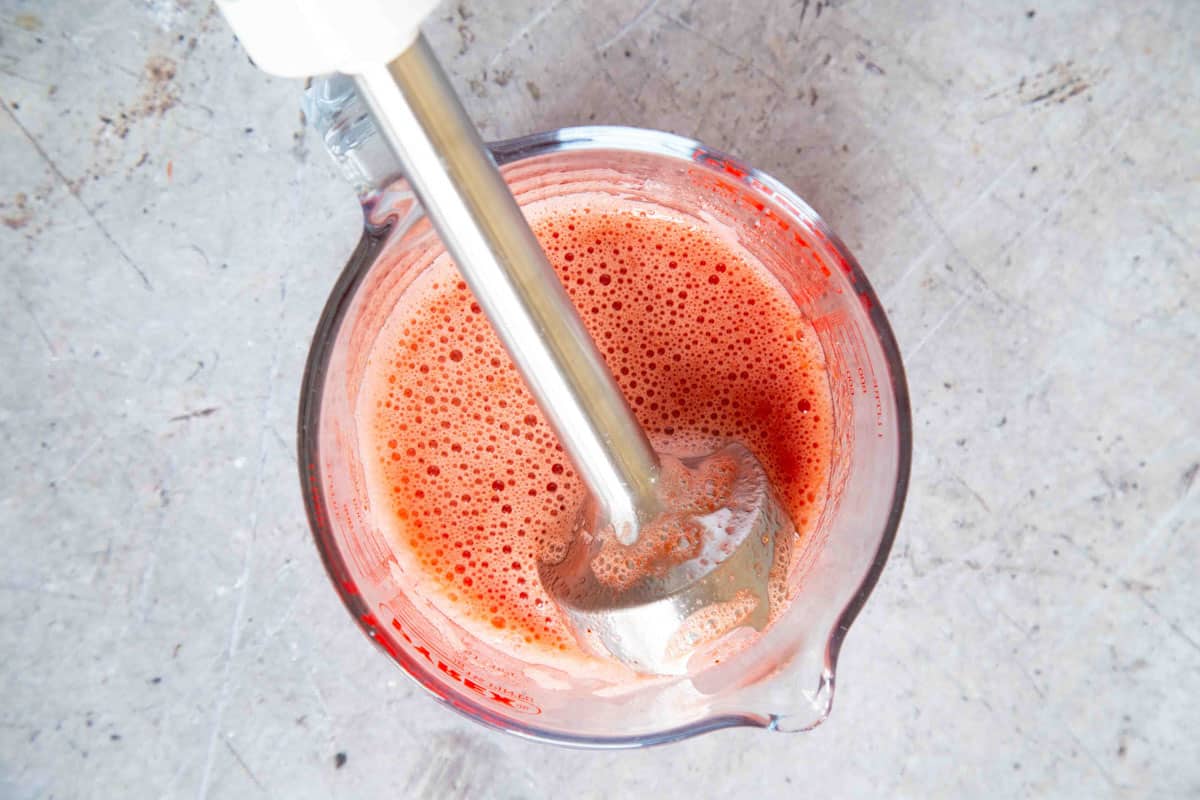 blending the puree with a stick bender until it is smooth