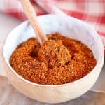a bowl of the reddish ochre seasoning blend
