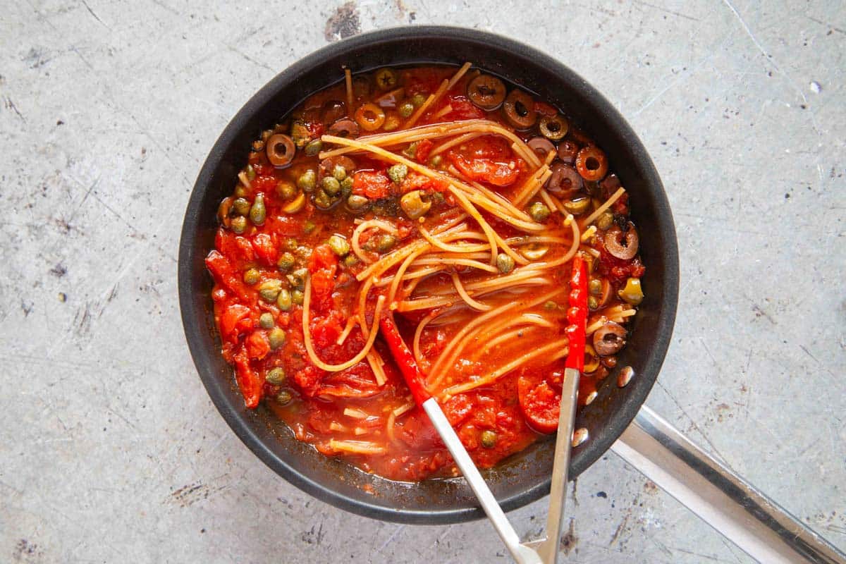 half way through cooking, the spaghetti has started to soften