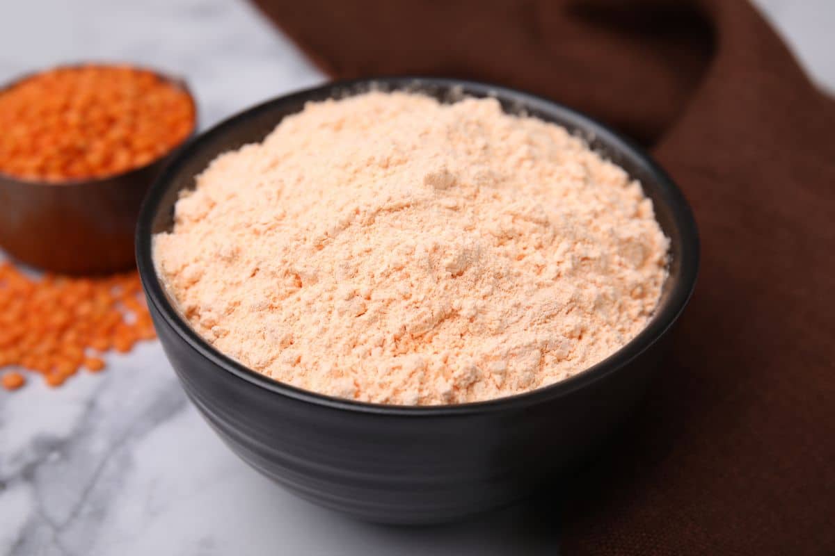 a bowl of pale orange red lentil flour