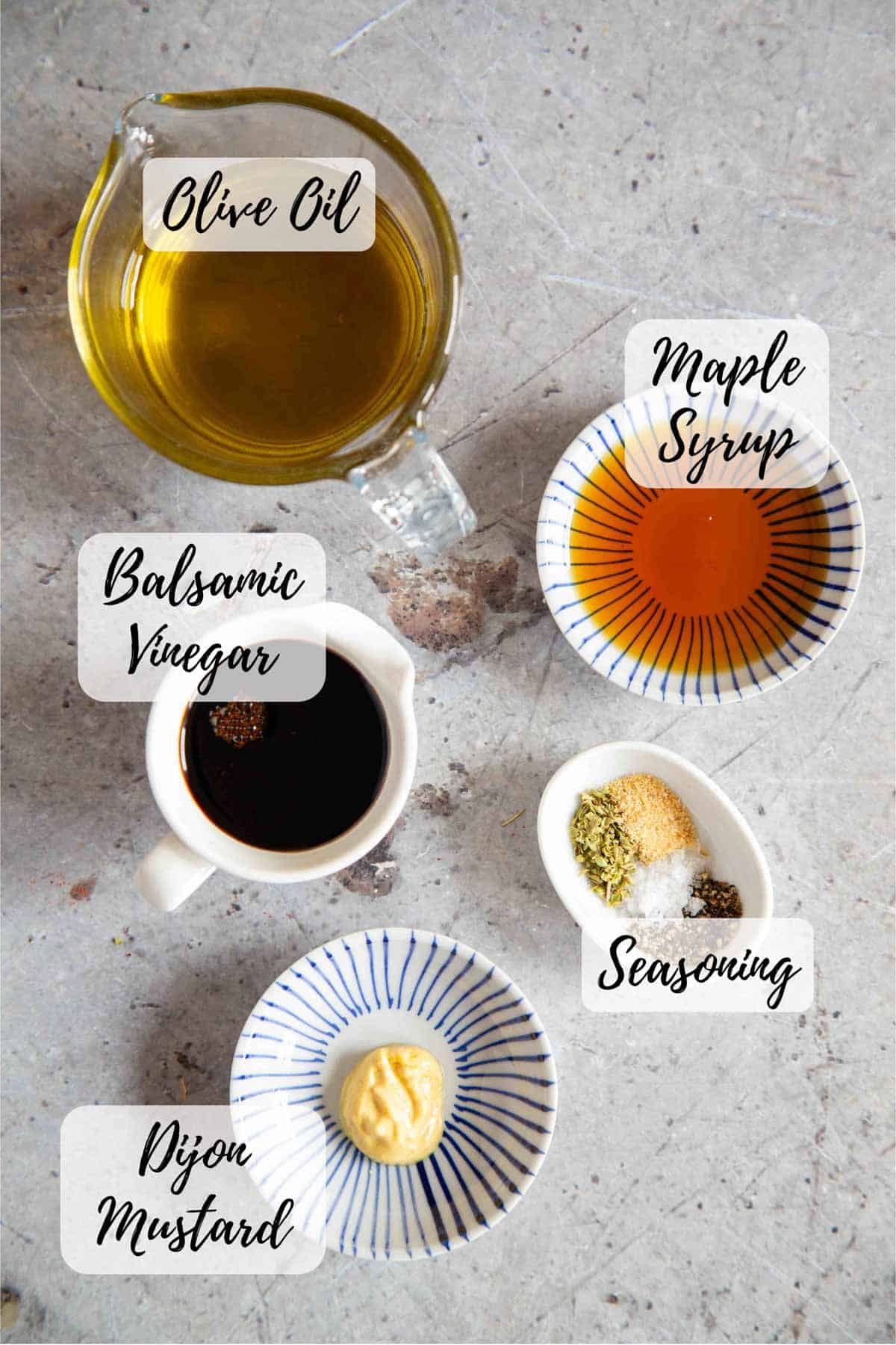 the ingredients for making the dressing have been measured out into prep bowls