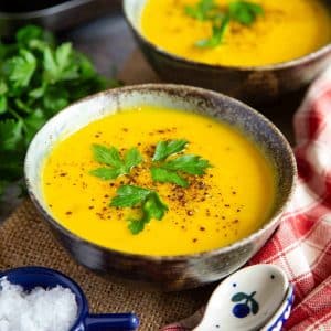 two bowls of golden butternut squash soup