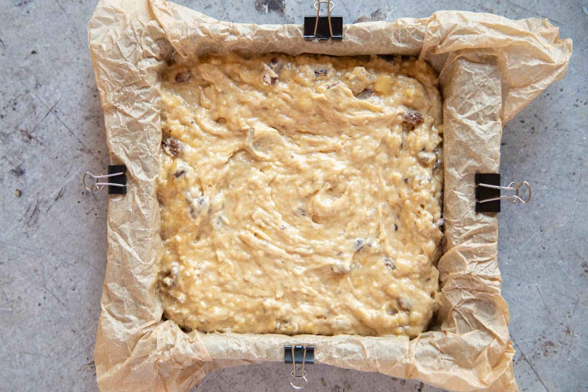 the batter has been transferred to a baking pan lined with parchment
