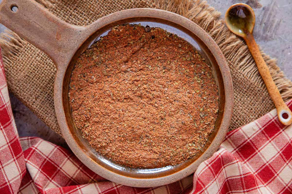 Cajun seasoning in a round earthenware dish from above