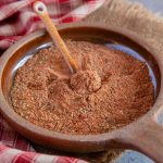 Richly flavoured cajun seasoning in a shallow earthenware dish.