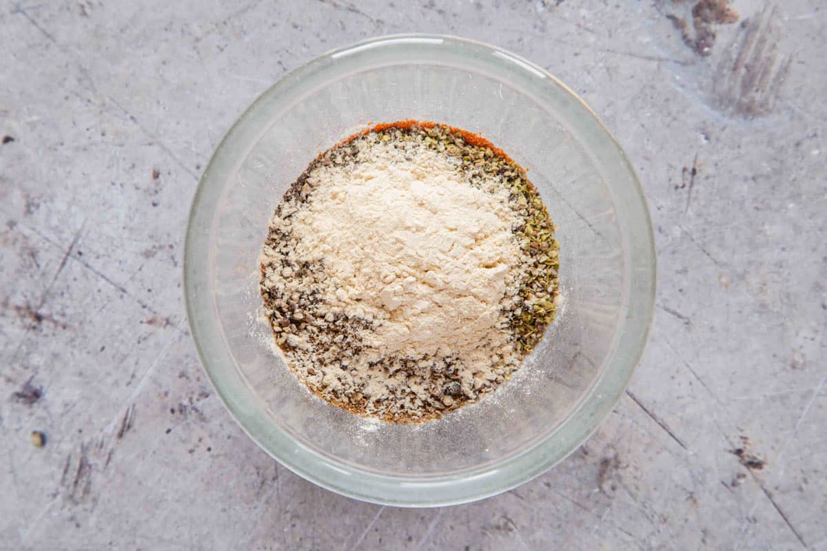 All the ingredients for cajun seasoning added to a bowl