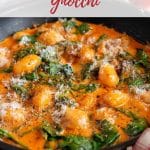 Rich orange sauce on creamy chicken gnocchi served from a frying pan