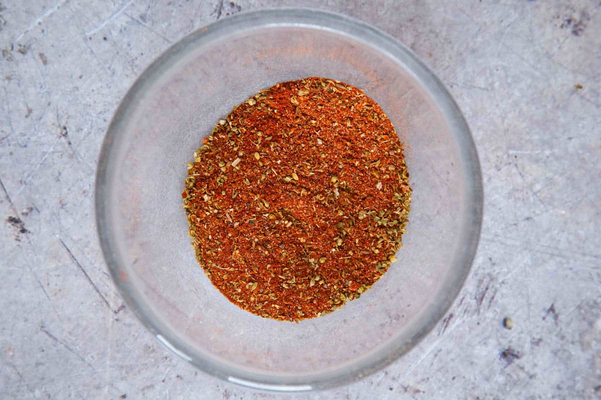 A glass bowl of mixed fajita seasoning