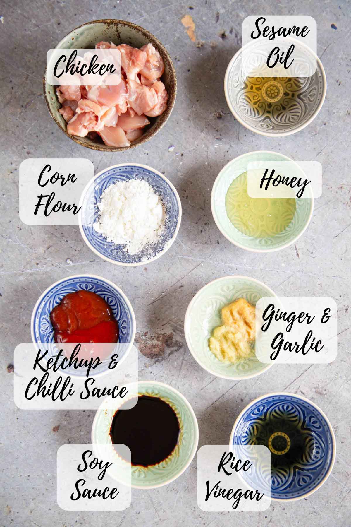 Ingredients for honey chilli chicken chicken sesame oil corn flour honey garlic and ginger puree ketchup and chilli sauce soy sauce and rice vinegar