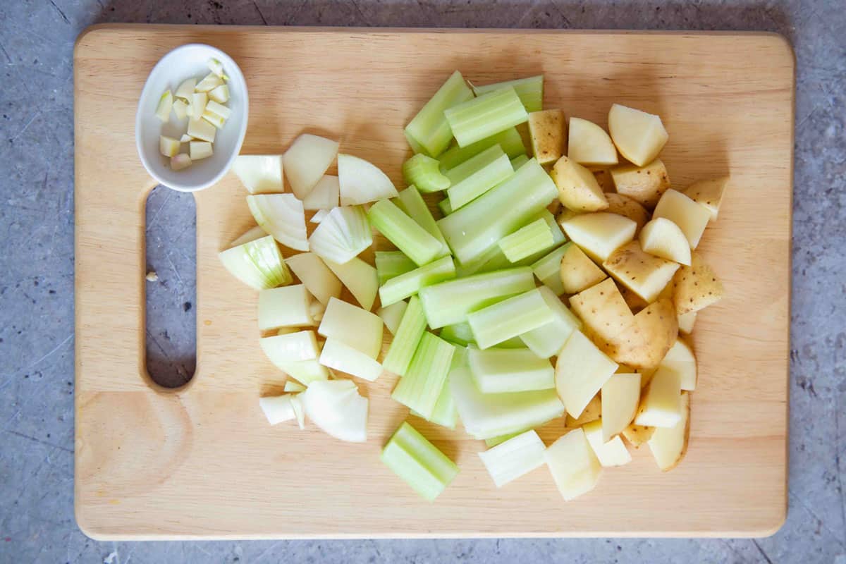first the onion garlic celery and potato are chopped into chunks