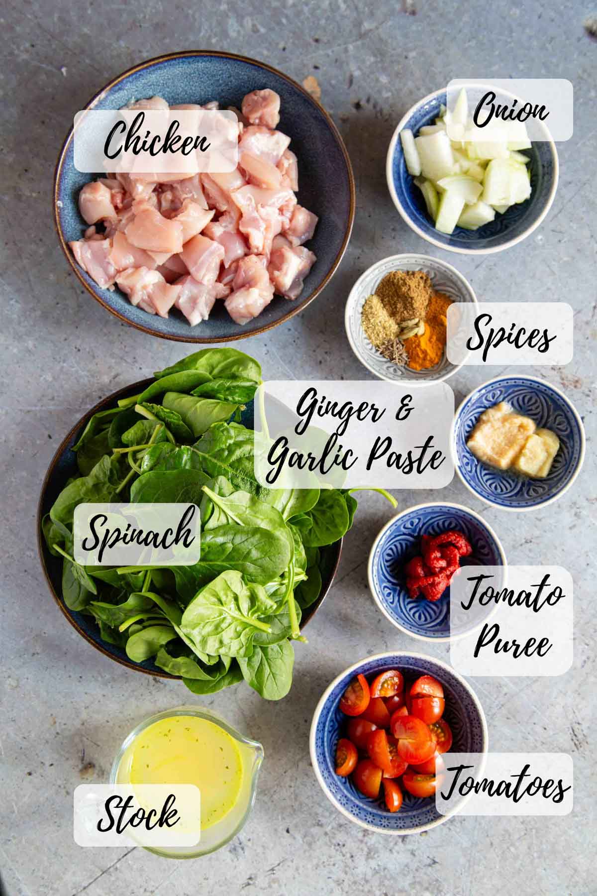 Ingredients are chicken spinach onion spices ginger & garlic paste tomato paste fresh tomatoes and stock