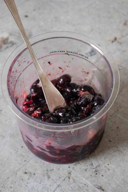 Stirring up and crushing the blueberries